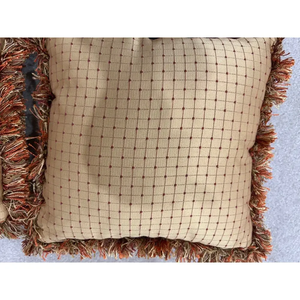 Pair of grid or checkpattern throw pillows orange brown gold